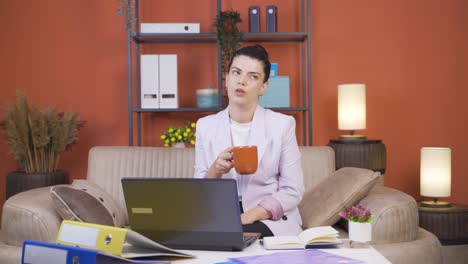 Home-office-worker-young-woman-taking-a-break-from-her-work.